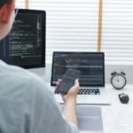 Introduction to Web and Mobile Development for Startup Founders software development concept male programmer check h8n29xu