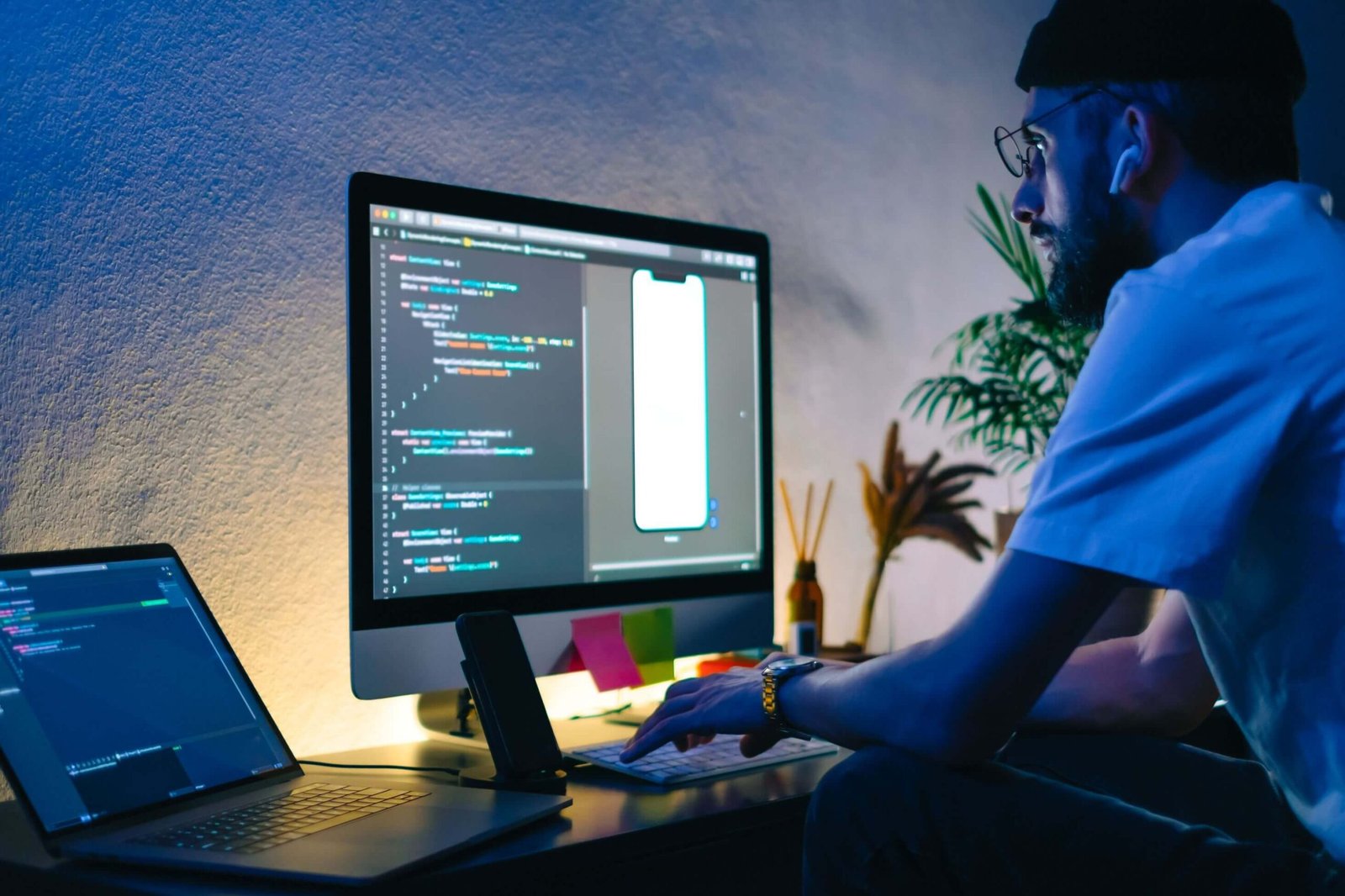 young man mobile developer writes program code on 3fbnk5r scaled 1.jpg